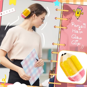 Detail of cute pencil hair claw clip in yellow and pink showing secure hold for ponytail