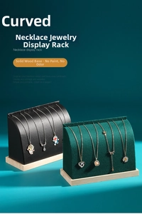 Detailed side view of curved wooden necklace display stands with premium velvet finish