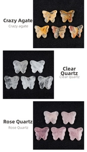 Detailed view of natural butterfly crystal stone pendants in agate, white and rose quartz