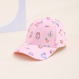 Close-up of pink cotton baseball cap featuring colorful cartoon patterns and embroidery