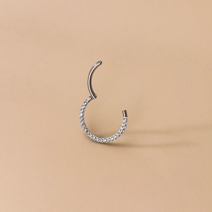 Titanium hinged clicker ring with half-circle inlaid zircons for nose and ear piercing