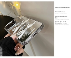 Close-up of silver mirror phone case with 3D white bow and precise port cutouts