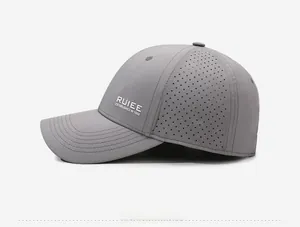 Detail of grey baseball cap featuring laser-cut ventilation holes and quick-dry fabric