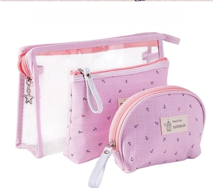 Detailed view of pink three-piece travel toiletry set with waterproof fabric and stars charm