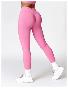 Detail of pink high-waisted yoga pants with seamless texture and push-up effect on the back