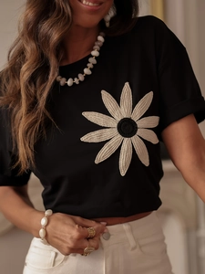 Slim fit black T-shirt featuring a large white 3D crochet flower embroidery and round neck
