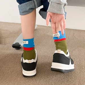 Street style color block skateboard crew socks with blue red and green stripes