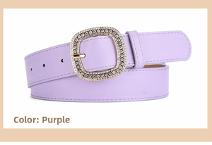 Close-up of a light purple leather belt featuring a large rectangular rhinestone buckle