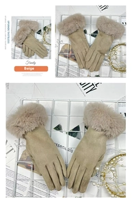Detail of beige winter gloves with faux fur trim and warm fleece lining for women