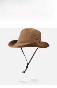 Detail of brown waterproof hiking sun hat with side snaps and adjustable chin strap