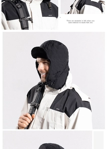 Detailed view of black quilted trapper hat with soft faux fur lining and ear flaps