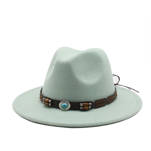 Detailed view of mint green felt wide brim fedora with turquoise beaded leather band