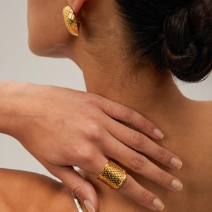 Detail of 18k gold plated ring and earrings set featuring unique fish scale texture
