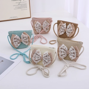 Straw woven girls crossbody bags with lace bows in assorted colors for summer kids