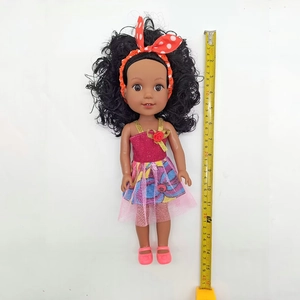Detailed 35cm black reborn doll with curly hair, polka dot headband and pink dress