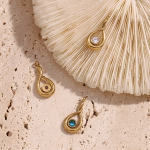 Detail of 18K gold plated teardrop pendants with white, pink and blue zircon stones