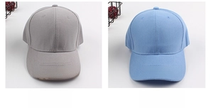 Detail view of cotton twill baseball caps in light grey and blue with 6-panel structure