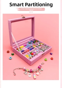 Detail of pink velvet jewelry box with colorful DIY beads and unicorn charm bracelet