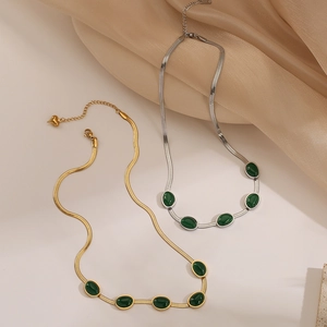 Retro emerald blade snake chains in gold and silver finish with green oval gemstones