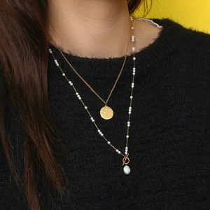 18K gold plated layered necklace with baroque pearls and OT toggle clasp on model