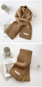 Close-up of camel knit scarf texture with stylish brand label on high-quality fabric