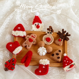 Knitted Christmas ornament set with Santa and reindeer on a rustic tray for decor
