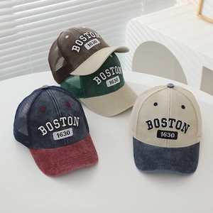 Detailed embroidery of Boston 1630 and breathable mesh texture on the trucker cap