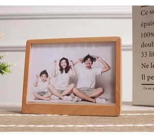 Close-up of a trapezoid beech wood photo frame with natural grain on a woven mat