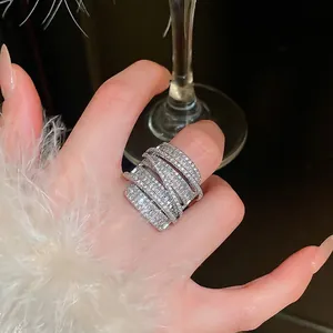 Luxurious silver layered ring with zircon wrap design and sparkling square diamonds