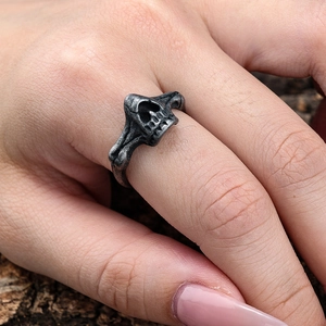 Detailed close-up of a vintage gothic skull ring with an oxidized silver finish for men