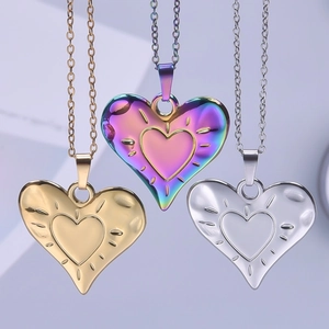 Three 18k gold-plated stainless steel heart pendant necklaces in gold, silver and rainbow