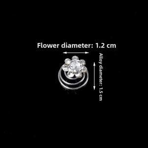 Detailed macro view of crystal rhinestone plum flower hair pins with silver spiral base