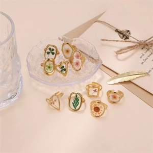Minimalist gold stainless steel open rings with preserved dried flowers in resin