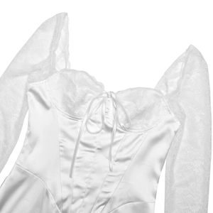 Detail of white satin corset top with floral lace sleeves and delicate front bow tie