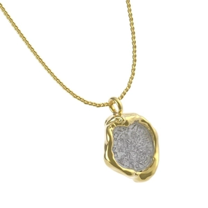 Close-up of 18k gold plated necklace with irregular silver coin pendant on white background