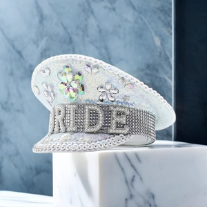 Detailed view of the Bride captain hat with silver sequins, pearls, and rhinestone lettering