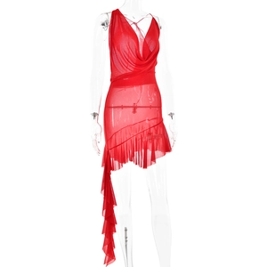 Detail of red mesh cowl neck dress with asymmetric ruffled hem on mannequin