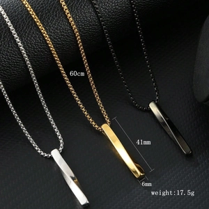 Detailed view of twisted steel necklaces in silver, gold, and black finishes