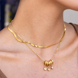 Double-layered 18K gold plated stainless steel necklace with round pendant and crystal zircon