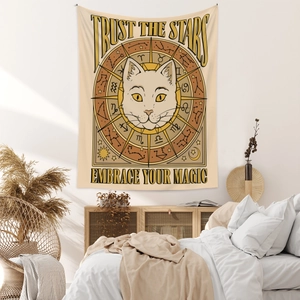 Detail of bohemian cat tapestry with zodiac stars map in a cozy minimalist bedroom