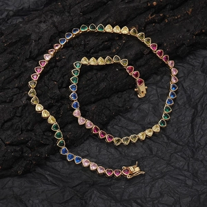 Rainbow heart-shaped tennis necklace in gold setting with multi-colored cubic zirconia gems