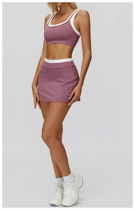 Detail of high-waisted purple yoga skirt with white elastic waistband and smooth fabric