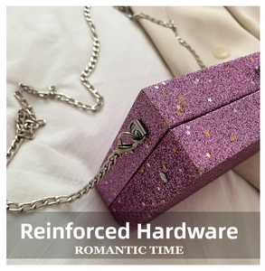 Close-up of reinforced silver hardware hook on a purple sequin box bag with star glitter
