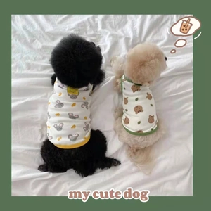 Detail of lightweight cotton dog vests featuring mouse and bear prints for summer