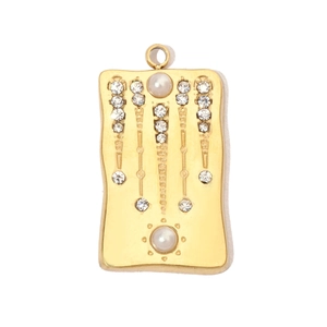 Detailed view of gold plated rectangular pendant with shimmering zircon and pearl insets
