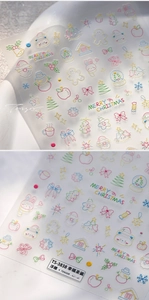 Detailed macro of 5D embossed Christmas nail stickers featuring Santa and snowflake designs