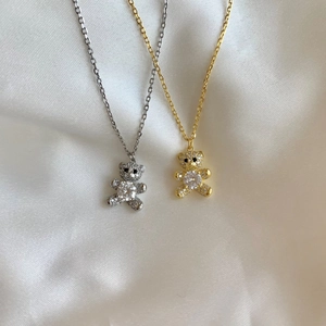 Sparkling S925 sterling silver bear necklaces in gold and silver finishes with pavé diamonds