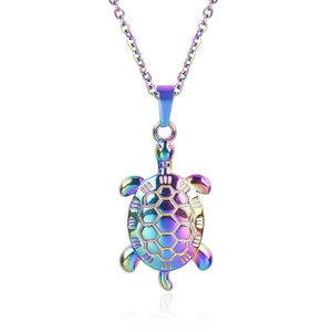 Macro shot of rainbow-plated stainless steel turtle pendant with hex pattern detail
