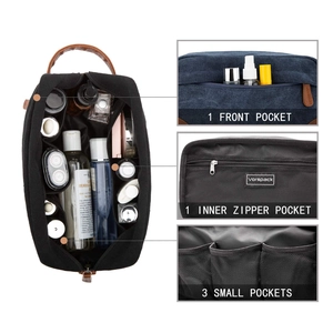 Close-up showing the multiple internal pockets and zipper compartment of canvas toiletry bag