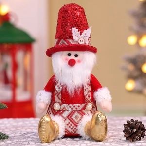 Detail of sitting Santa figurine with red sequin hat and white beard for Xmas decor